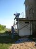 Jerry Vettel and Marv Bronner build scaffolding around bell tower